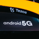An E Ink panel displaying an Android logo on a McLaren F1 race car.